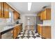 Well-maintained kitchen with stainless steel appliances and stylish black and white checkered floor at 2909 60Th N Ave, St Petersburg, FL 33714