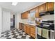 Updated kitchen with stainless steel appliances and black and white checkered flooring at 2909 60Th N Ave, St Petersburg, FL 33714