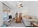 Cozy living room filled with natural light and tile floors with views of the neighborhood at 2909 60Th N Ave, St Petersburg, FL 33714