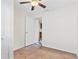 The spare bedroom features a ceiling fan, large window and leads to a small, eat-in kitchen space at 2909 60Th N Ave, St Petersburg, FL 33714