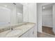 Bathroom featuring double sinks with granite countertop and a separate water closet at 3590 Moscato Dr, Brooksville, FL 34602