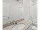 Bright bathroom with granite countertop, mirror, and shower-tub combo at 3590 Moscato Dr, Brooksville, FL 34602