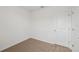 Small carpeted bedroom with a closet at 3590 Moscato Dr, Brooksville, FL 34602