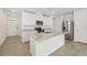 Modern kitchen featuring white cabinets, stainless steel appliances, and a granite countertop island at 3590 Moscato Dr, Brooksville, FL 34602