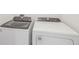 New white, front load Whirlpool brand washer and dryer set in a laundry room at 3590 Moscato Dr, Brooksville, FL 34602