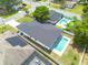Aerial view of home with backyard pool and lush landscaping at 4021 Ohio Ave, Tampa, FL 33616