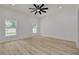 Spacious bedroom with modern flooring, bright windows, and a ceiling fan at 4021 Ohio Ave, Tampa, FL 33616