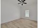 This bedroom is bright and open, featuring a modern ceiling fan and light hardwood flooring at 4021 Ohio Ave, Tampa, FL 33616