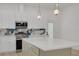 Stylish kitchen with stainless steel appliances, stone countertops, and pendant lighting at 4021 Ohio Ave, Tampa, FL 33616