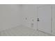 A clean laundry room with decorative flooring and an access door at 4021 Ohio Ave, Tampa, FL 33616