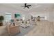 Stylishly furnished living room featuring neutral tones, wood floors, and an open floor plan at 4021 Ohio Ave, Tampa, FL 33616