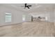 Spacious living room with wood floors, plenty of natural light, and an open layout to the kitchen at 4021 Ohio Ave, Tampa, FL 33616