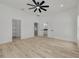 Large primary bedroom features wood floors, closet, and an ensuite bathroom at 4021 Ohio Ave, Tampa, FL 33616