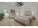 Inviting main bedroom with a ceiling fan, bright windows, and neutral decor at 4021 Ohio Ave, Tampa, FL 33616