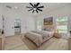 Inviting main bedroom featuring bright windows, a ceiling fan, and a bathroom at 4021 Ohio Ave, Tampa, FL 33616