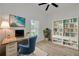 Cozy home office with a modern desk, stylish bookshelf, and a bright window at 4021 Ohio Ave, Tampa, FL 33616