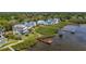 Beautiful view of waterfront homes along a scenic shore, with private docks and lush surroundings at 404 Hillsborough St, Palm Harbor, FL 34683