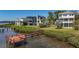Aerial view showing a waterfront home with private dock and lush landscaping at 404 Hillsborough St, Palm Harbor, FL 34683