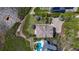 Aerial view showcasing a property with mature landscaping, dock, and a pool at 404 Hillsborough St, Palm Harbor, FL 34683