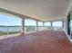 Large covered balcony with stucco decking and water views at 404 Hillsborough St, Palm Harbor, FL 34683