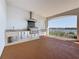 Outdoor kitchen featuring stainless steel appliances with waterfront views from the balcony at 404 Hillsborough St, Palm Harbor, FL 34683