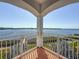 Balcony overlooking tranquil water and landscaped yard at 404 Hillsborough St, Palm Harbor, FL 34683