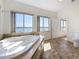 Bathroom featuring a jacuzzi tub with tranquil water views from the large windows at 404 Hillsborough St, Palm Harbor, FL 34683