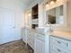 Bathroom featuring double vanities, tile flooring, and modern fixtures at 404 Hillsborough St, Palm Harbor, FL 34683