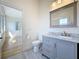 Bathroom features gray vanity with marble top and a view into the bedroom at 404 Hillsborough St, Palm Harbor, FL 34683