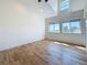 Light-filled bedroom with wood floors and windows offering scenic views at 404 Hillsborough St, Palm Harbor, FL 34683
