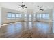 Spacious bedroom featuring hardwood floors, vaulted ceiling, and water views at 404 Hillsborough St, Palm Harbor, FL 34683