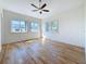 Bright bedroom features wood floors, multiple windows and great natural lighting at 404 Hillsborough St, Palm Harbor, FL 34683