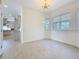 Dining room with natural light, hardwood floors, and view of kitchen at 404 Hillsborough St, Palm Harbor, FL 34683