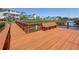 Wooden dock with bench seating, waterfront views, and lush vegetation at 404 Hillsborough St, Palm Harbor, FL 34683