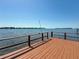 Wooden dock featuring scenic waterfront views and a sturdy safety railing at 404 Hillsborough St, Palm Harbor, FL 34683