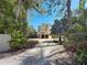Beautiful exterior view of home showcasing the driveway, landscaping, and architectural details at 404 Hillsborough St, Palm Harbor, FL 34683