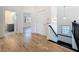 Bright hallway with beautiful hardwood floors leading to bathroom and bedroom at 404 Hillsborough St, Palm Harbor, FL 34683