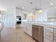Kitchen with stainless steel appliances, marble countertops and tile floors at 404 Hillsborough St, Palm Harbor, FL 34683