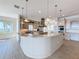 Gourmet kitchen with custom cabinets, island, and stainless steel appliances, perfect for culinary enthusiasts at 404 Hillsborough St, Palm Harbor, FL 34683