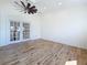 Bright living room with wood floors and french doors leading to a balcony at 404 Hillsborough St, Palm Harbor, FL 34683