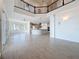 Open concept living and kitchen area with natural light and tile flooring, perfect for entertaining at 404 Hillsborough St, Palm Harbor, FL 34683