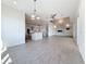 Spacious living area with tile floors, fireplace, and open kitchen, offering plenty of natural light at 404 Hillsborough St, Palm Harbor, FL 34683