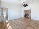 Bright living room featuring wood floors and an updated ceiling fan fixture at 404 Hillsborough St, Palm Harbor, FL 34683