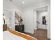Bright bedroom showcasing a modern design with minimalist decor and an open doorway to a bathroom at 409 E Oak Ave # 9, Tampa, FL 33602