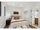 Bright and airy bedroom with a comfortable bed, ample storage, and an ensuite bathroom at 409 E Oak Ave # 9, Tampa, FL 33602