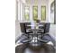 Bright breakfast nook with modern table and stylish chairs, illuminated by natural light from three windows at 409 E Oak Ave # 9, Tampa, FL 33602