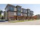 Beautiful modern townhomes feature brick facade and covered entryways at 409 E Oak Ave # 9, Tampa, FL 33602