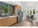 Modern kitchen and breakfast nook with stylish cabinets and backsplash at 409 E Oak Ave # 9, Tampa, FL 33602
