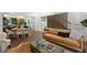 Bright living room featuring a comfortable sofa, modern decor, and hardwood floors at 409 E Oak Ave # 9, Tampa, FL 33602