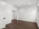 Clean and bright empty room with dark hardwood floors at 409 E Oak Ave # 9, Tampa, FL 33602
